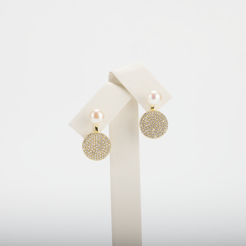 Pearl earrings on a white background