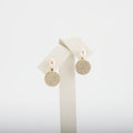 Pearl earrings on a white background
