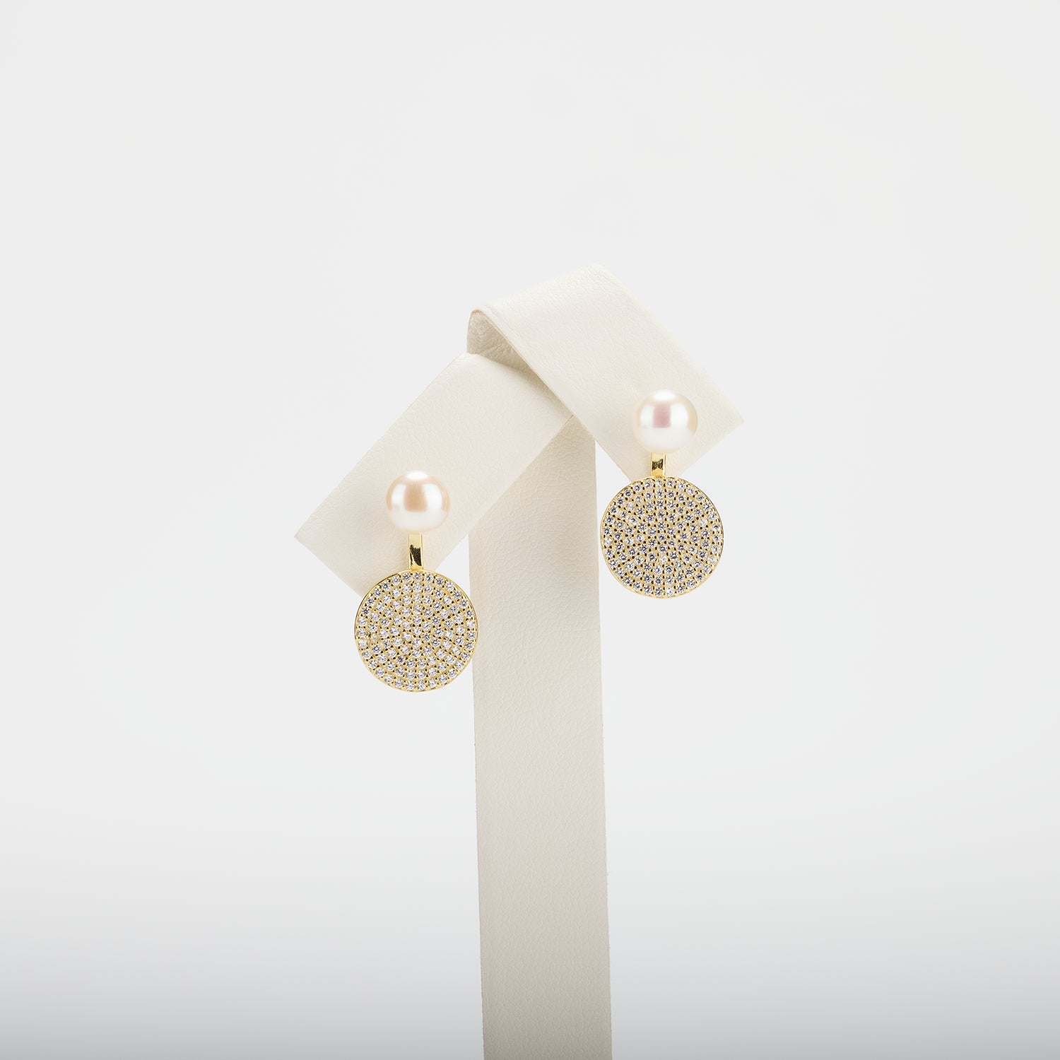 Pearl earrings on a white background