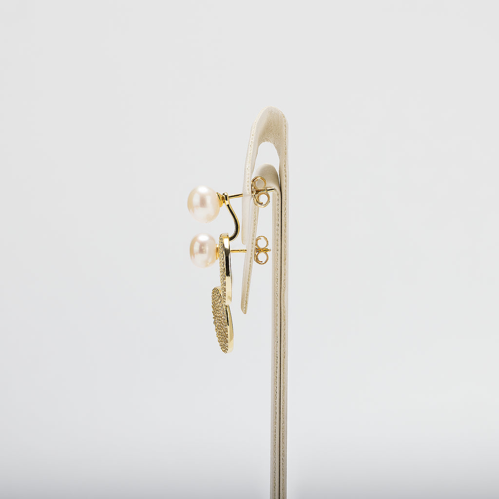 Pearl earrings on a white background