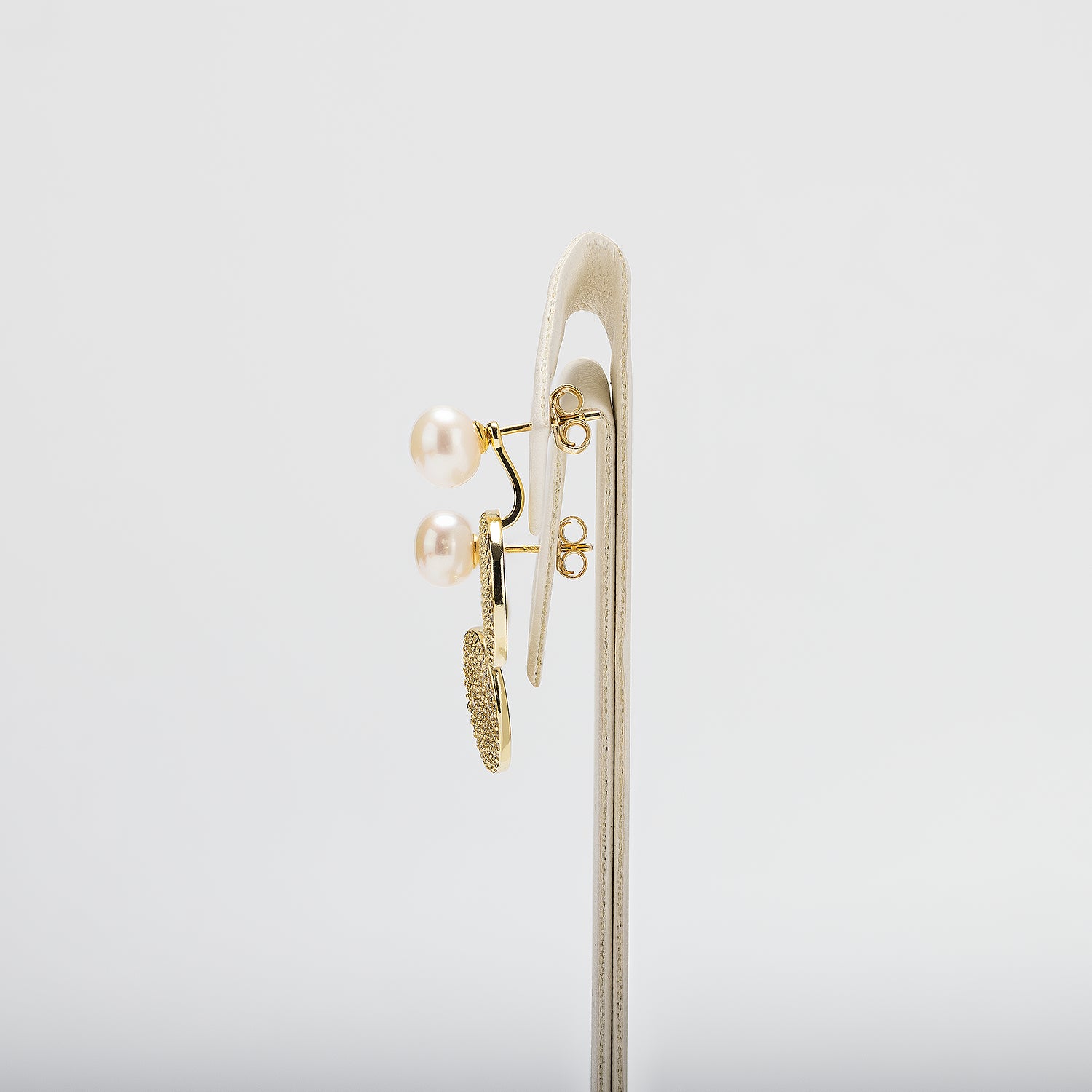 Pearl earrings on a white background