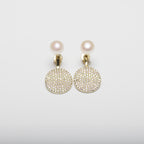 Pearl earrings on a white background