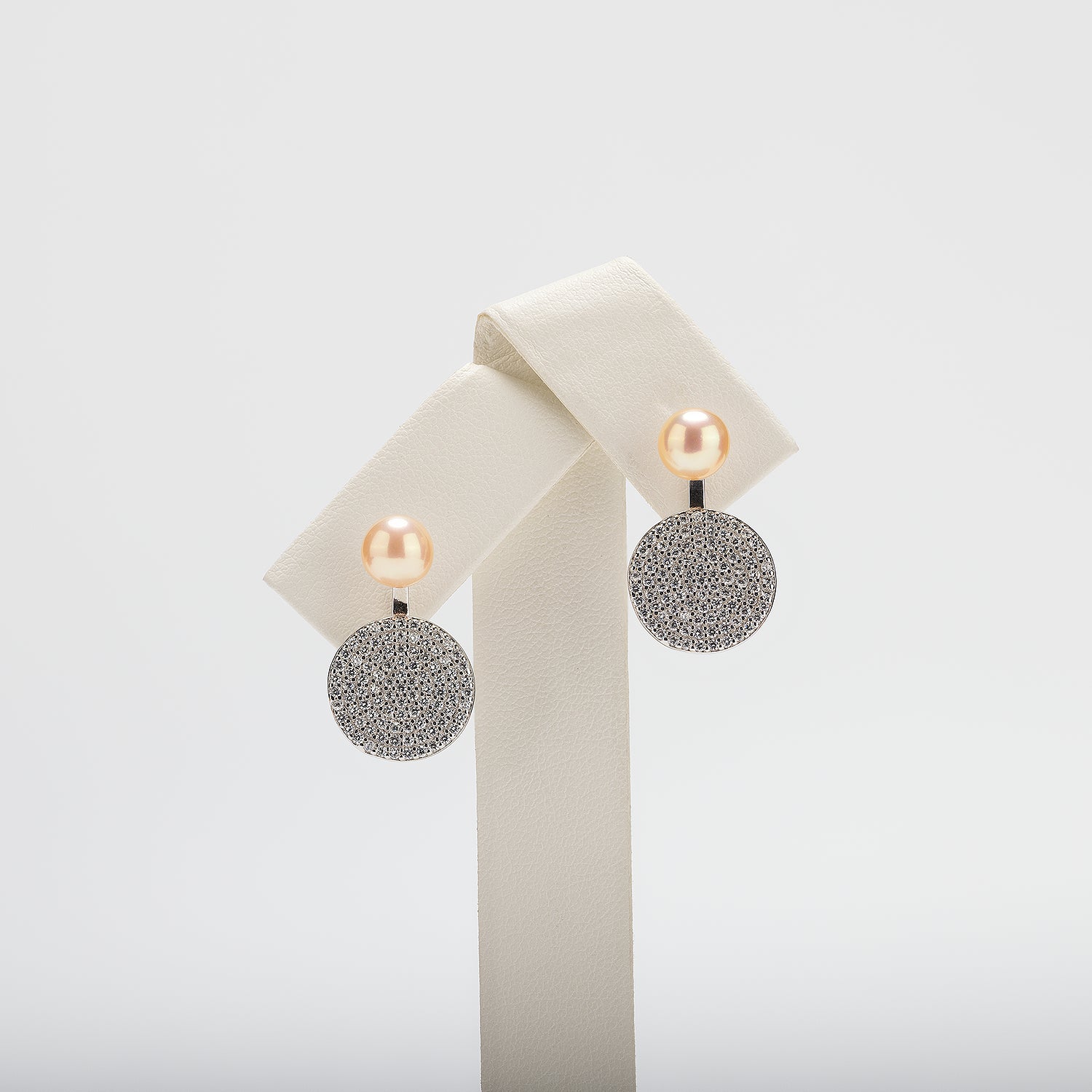 Pearl earrings on a white background