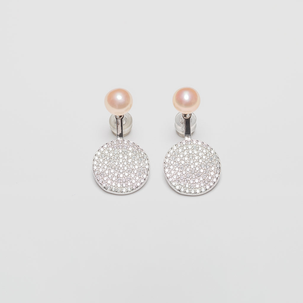 Pearl earrings on a white background