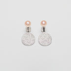 Pearl earrings on a white background