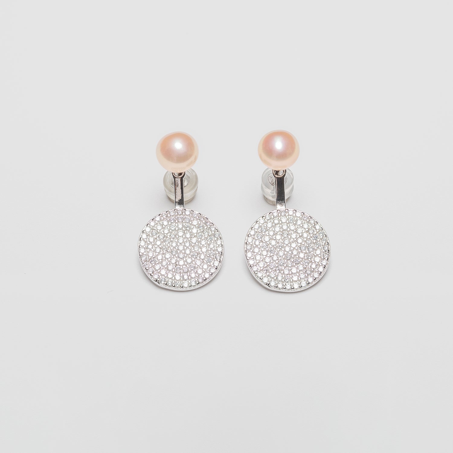 Pearl earrings on a white background