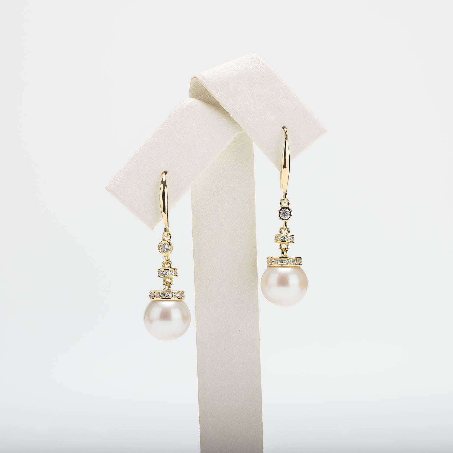 Pearl earrings on a white background