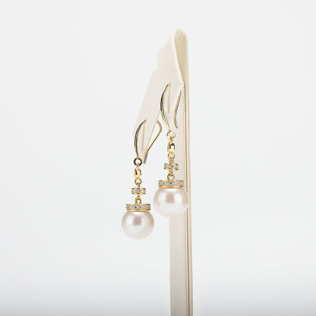 Pearl earrings on a white background