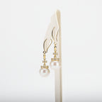 Pearl earrings on a white background