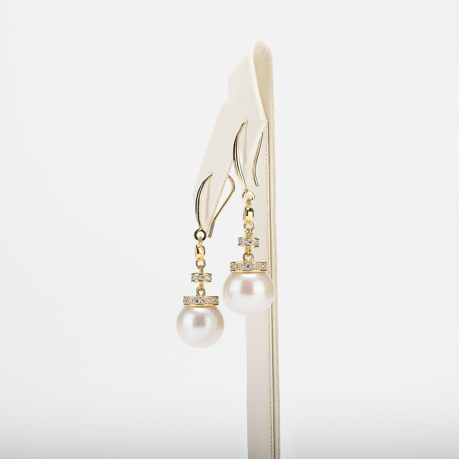 Pearl earrings on a white background