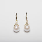 Pearl earrings on a white background
