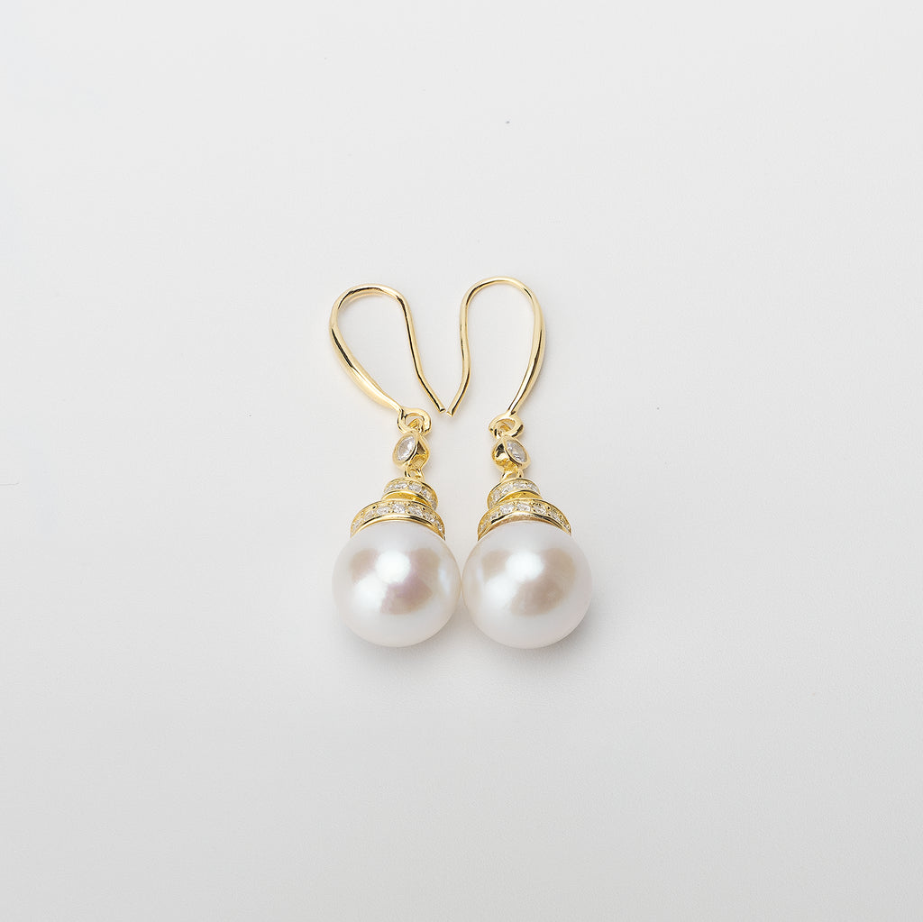 Pearl earrings on a white background
