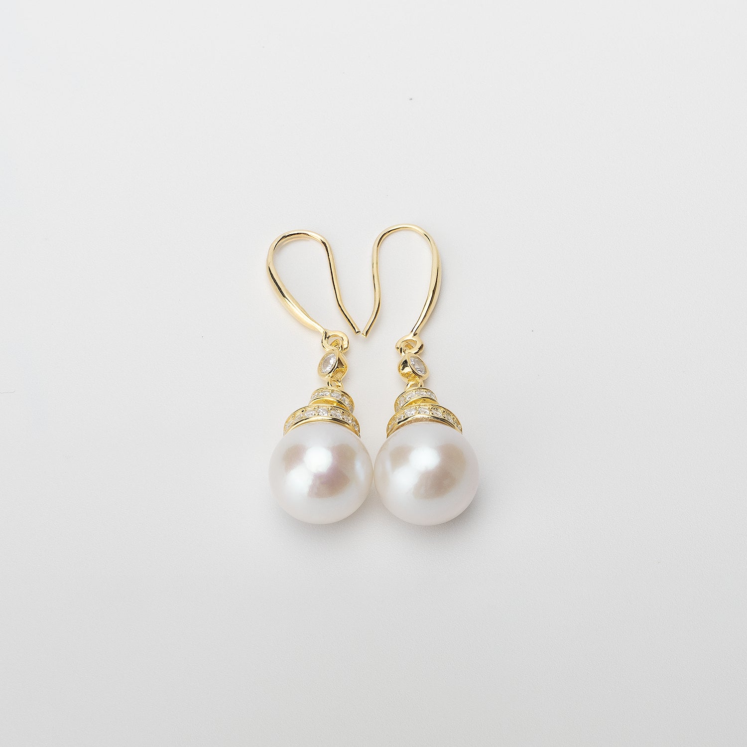 Pearl earrings on a white background