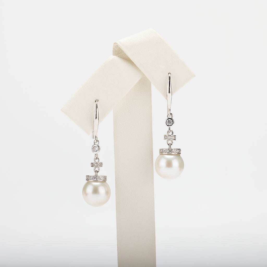 Pearl earrings on a white background