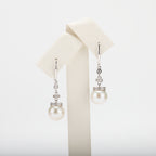 Pearl earrings on a white background