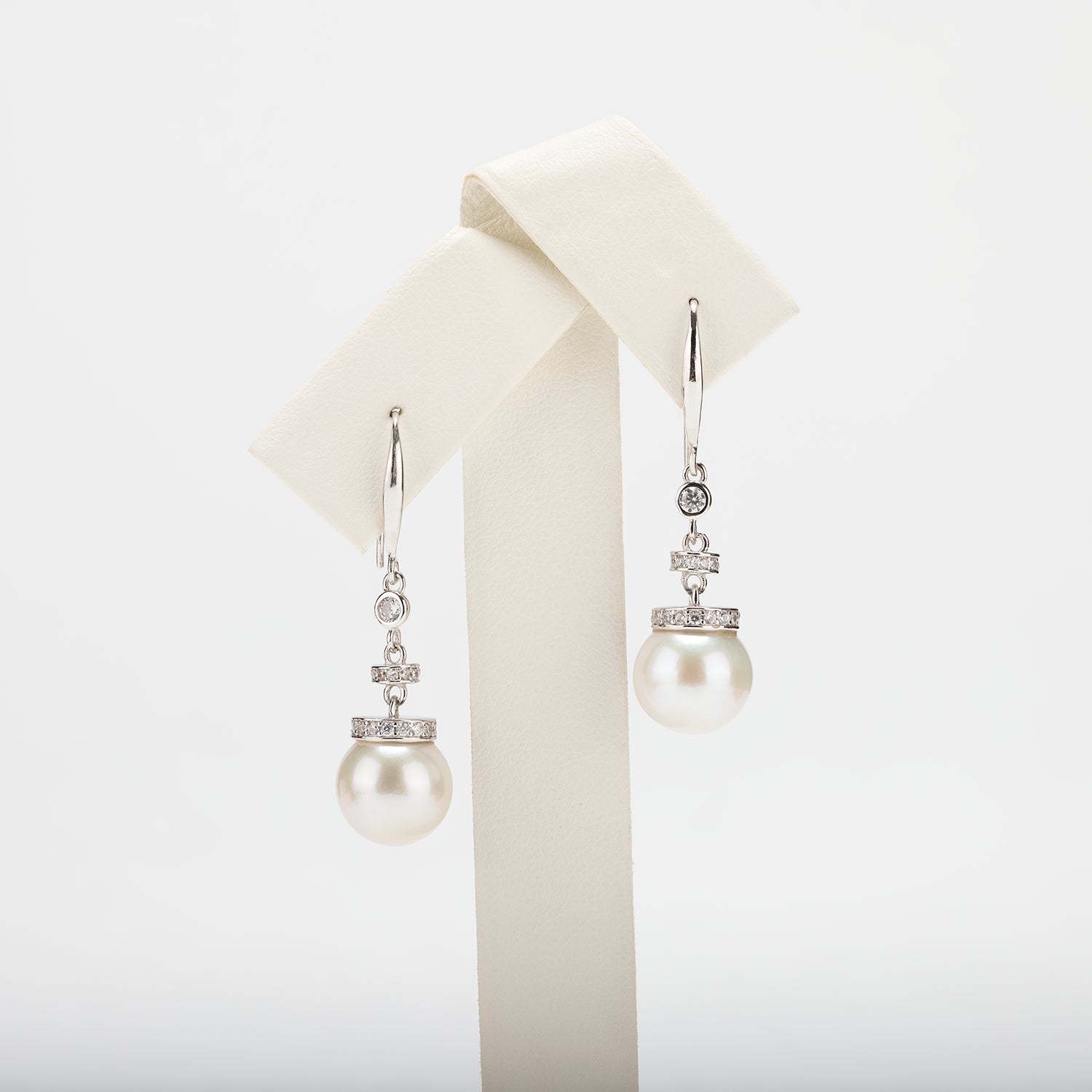 Pearl earrings on a white background