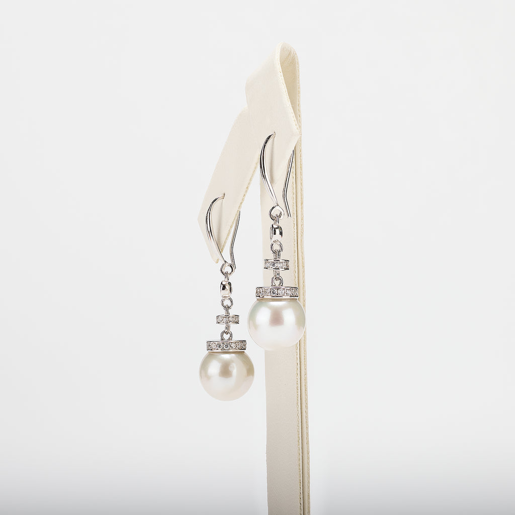 Pearl earrings on a white background