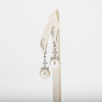 Pearl earrings on a white background