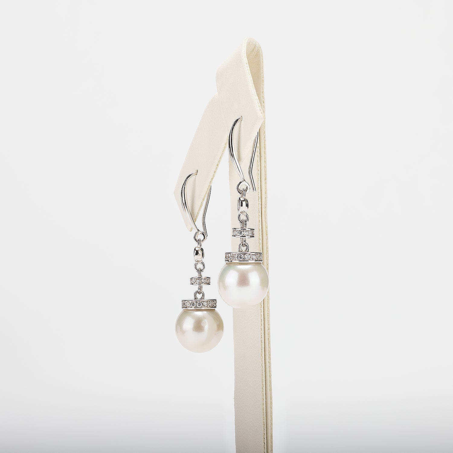 Pearl earrings on a white background