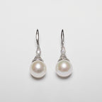Pearl earrings on a white background