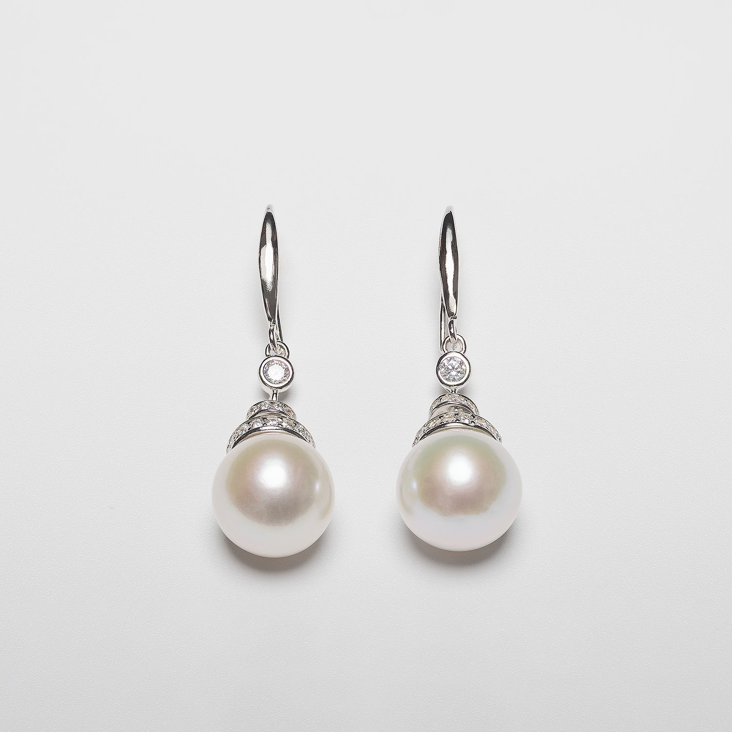 Pearl earrings on a white background