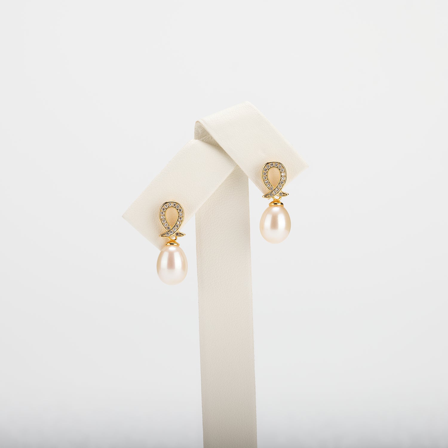 Pearl earrings on a white background