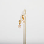 Pearl earrings on a white background