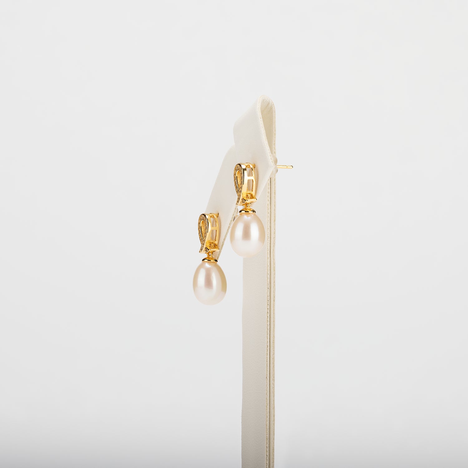Pearl earrings on a white background