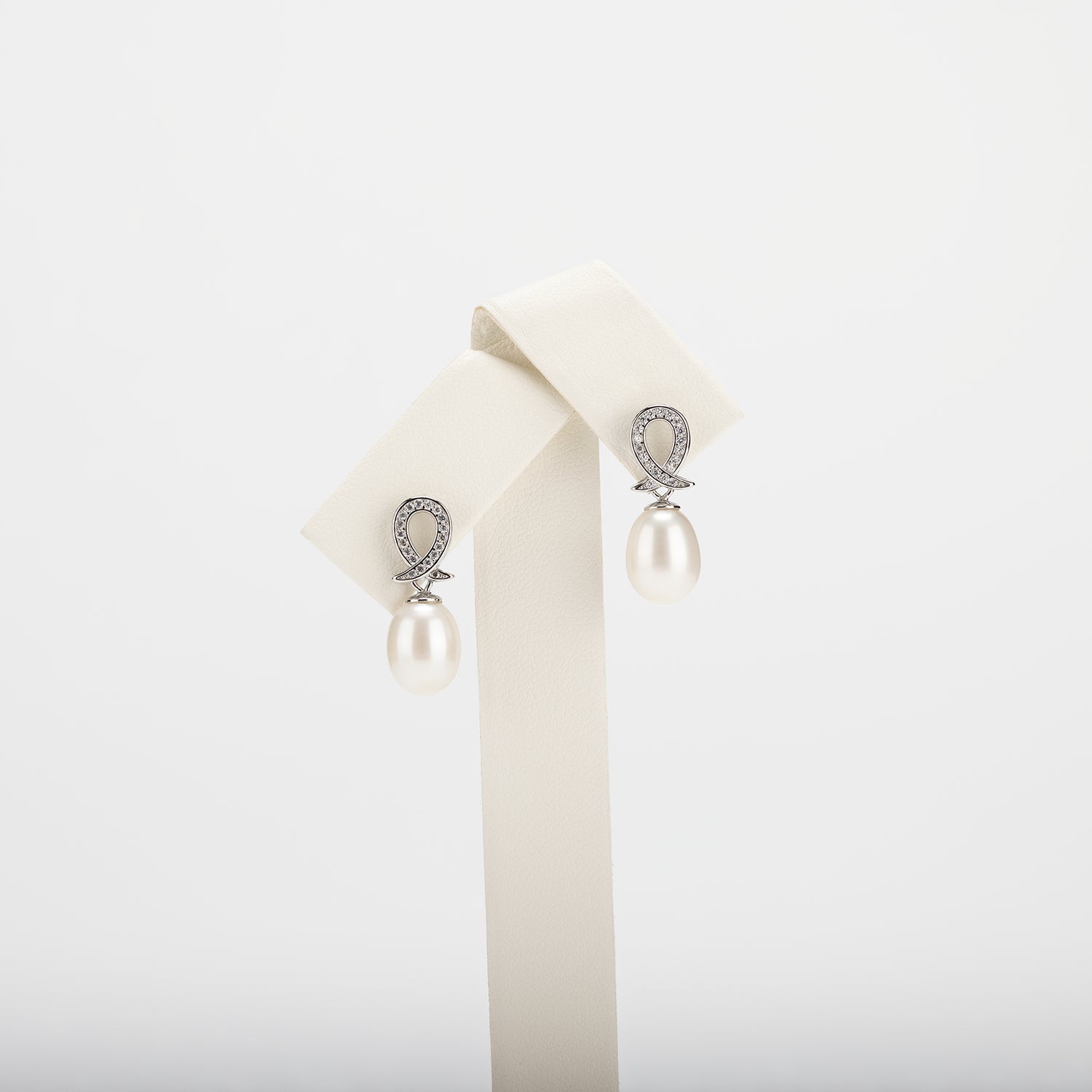 Pearl earrings on a white background