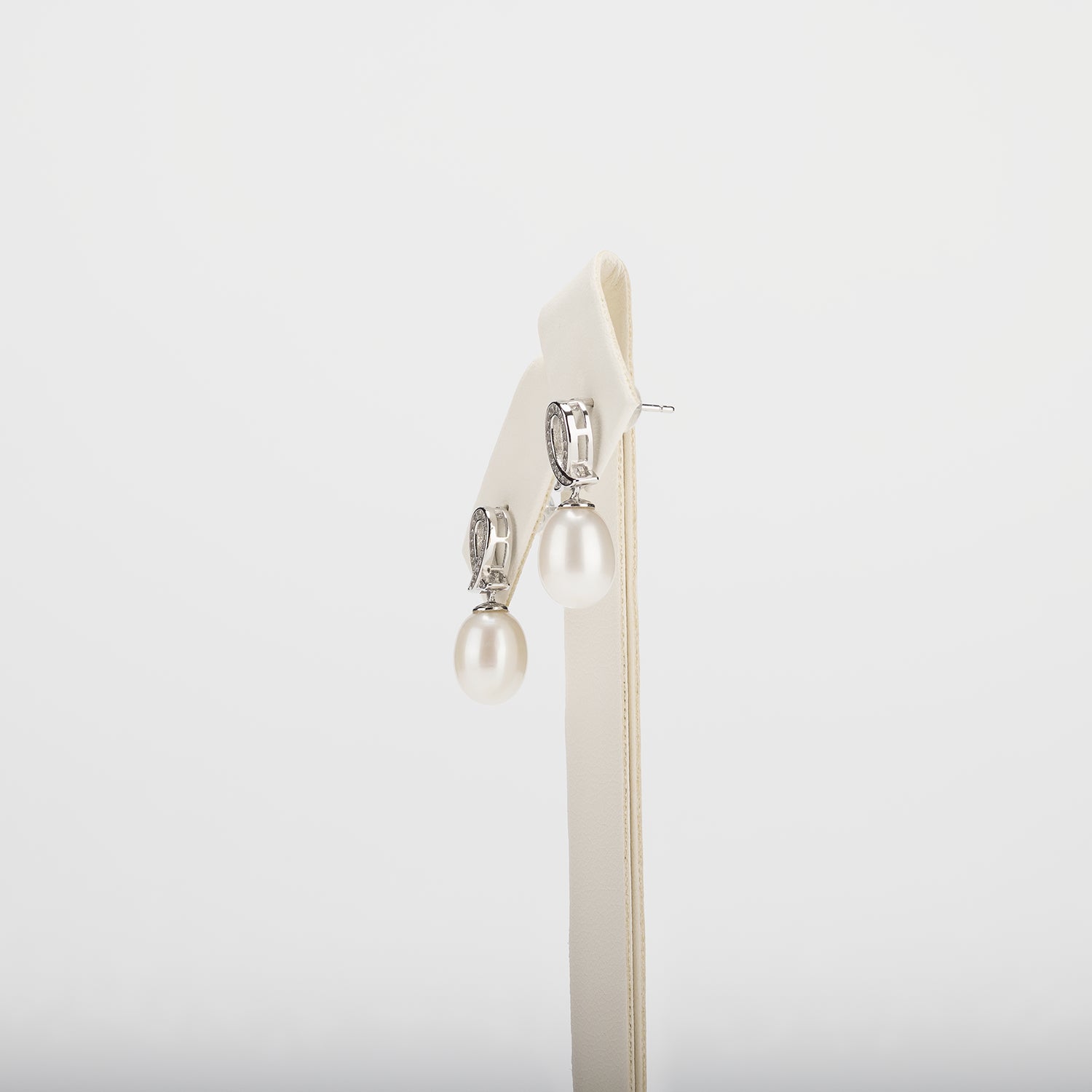 Pearl earrings on a white background