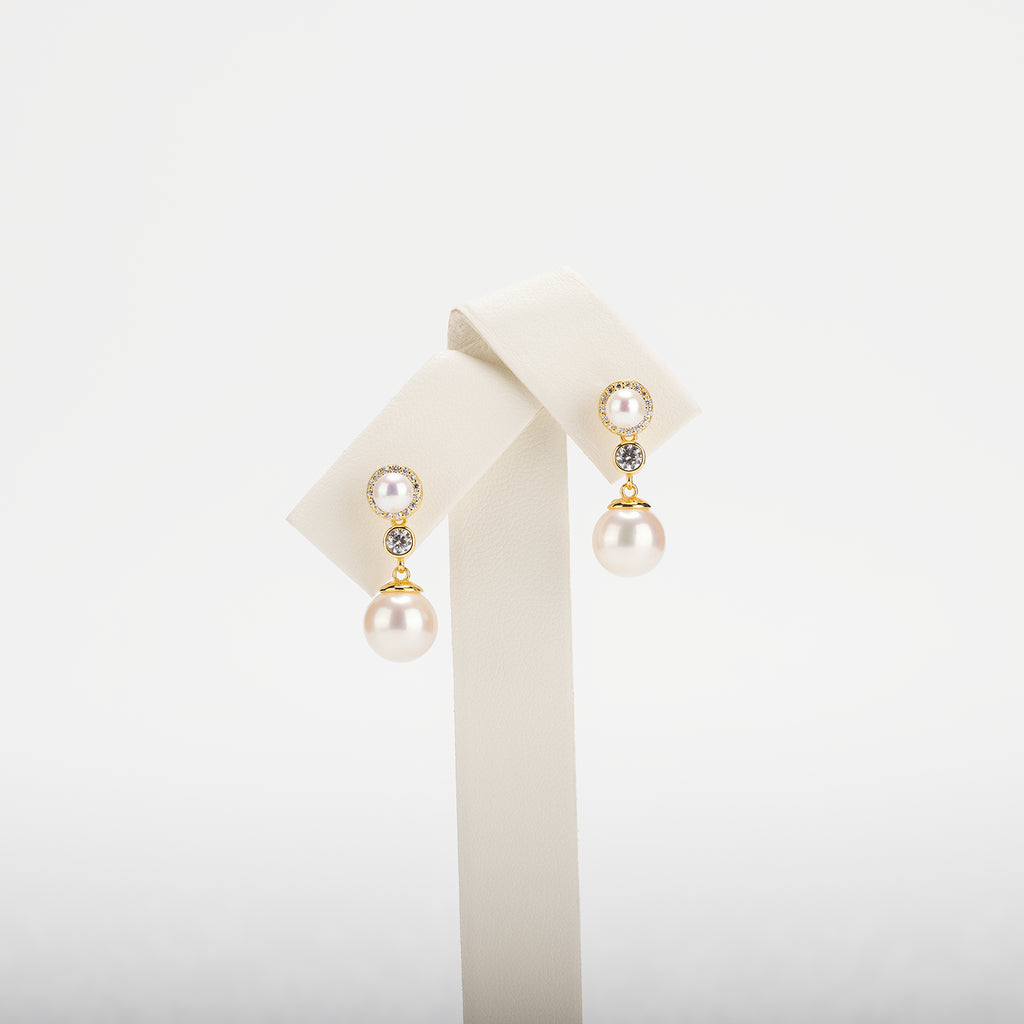 Pearl earrings on a white background