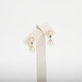 Pearl earrings on a white background