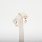 Pearl earrings on a white background