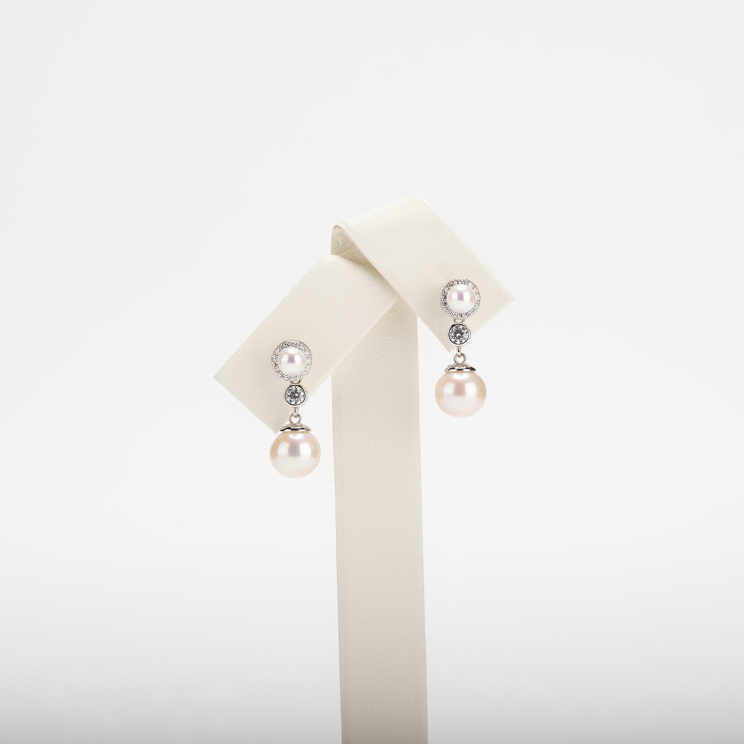 Pearl earrings on a white background