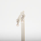 Pearl earrings on a white background