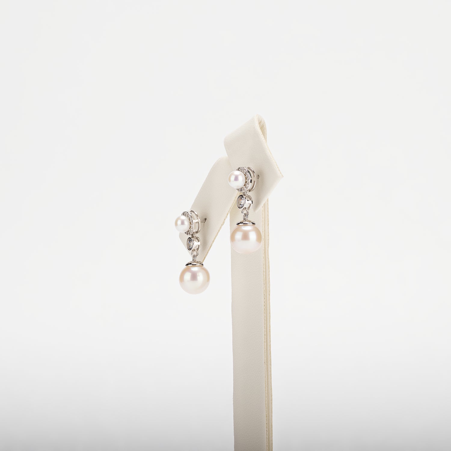 Pearl earrings on a white background