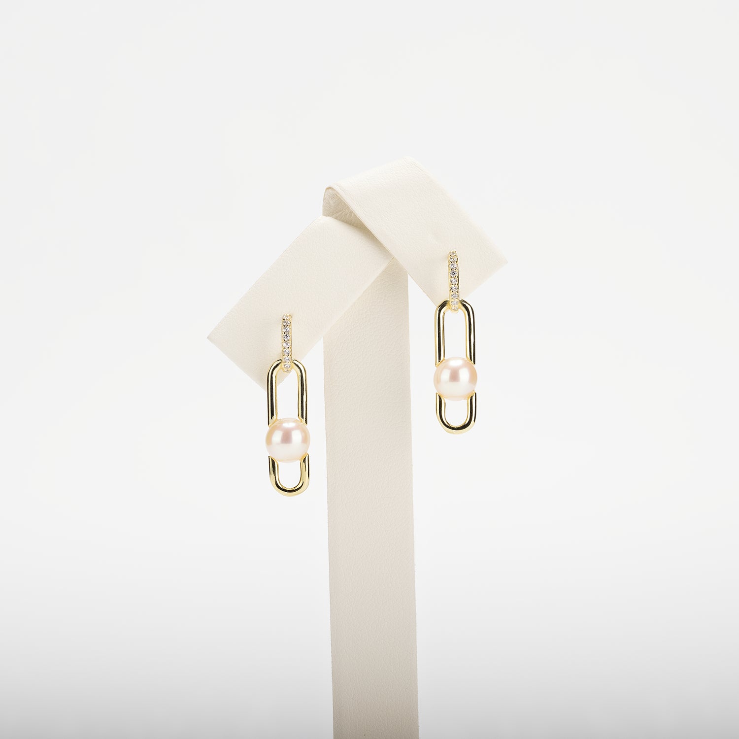 Pearl earrings on a white background