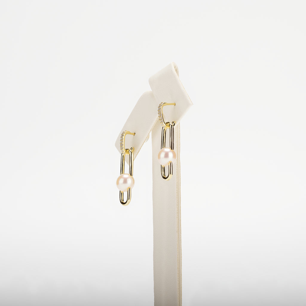 Pearl earrings on a white background