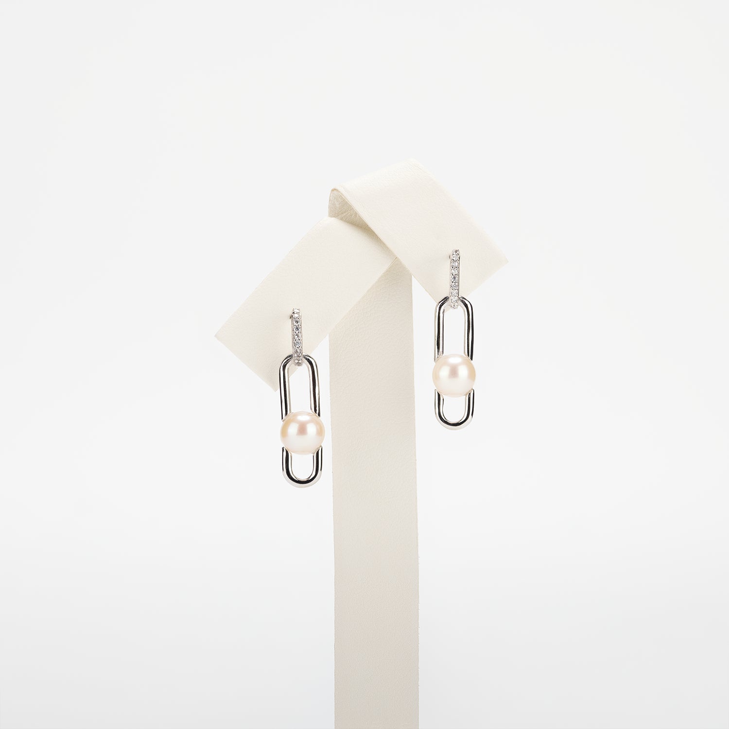 Pearl earrings on a white background