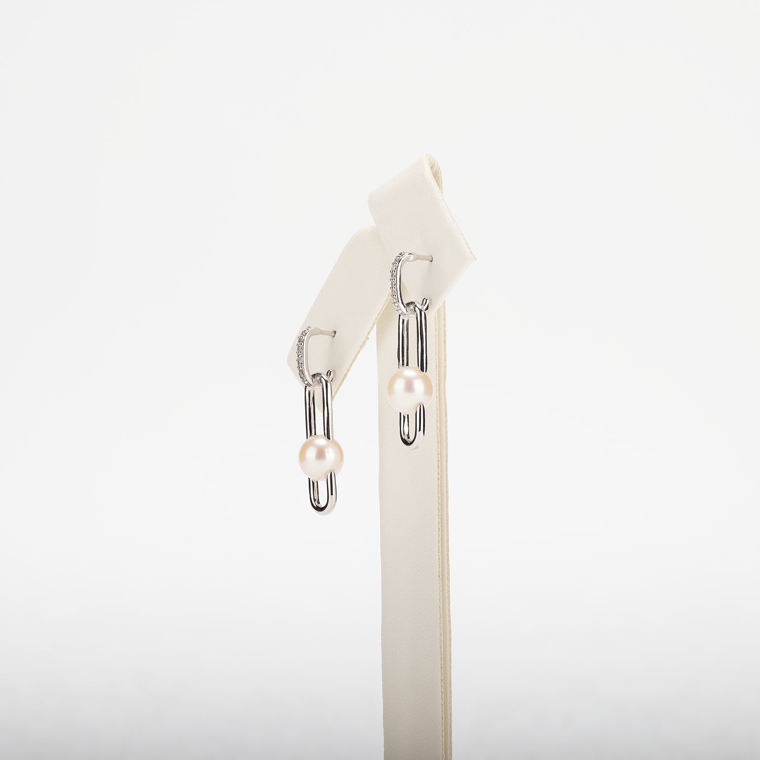 Pearl earrings on a white background