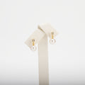 Pearl earrings on a white background