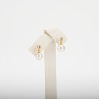 Pearl earrings on a white background