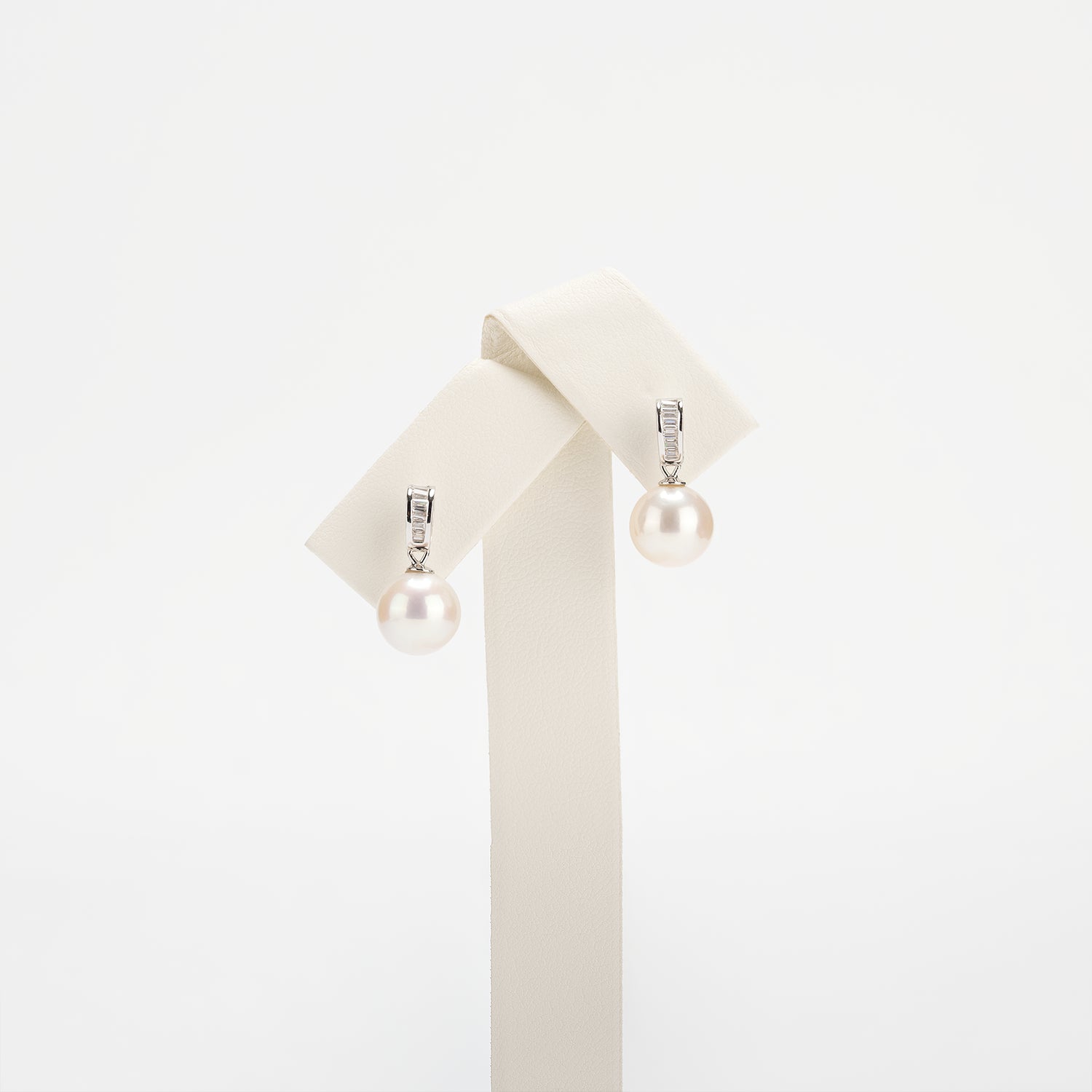 Pearl earrings on a white background