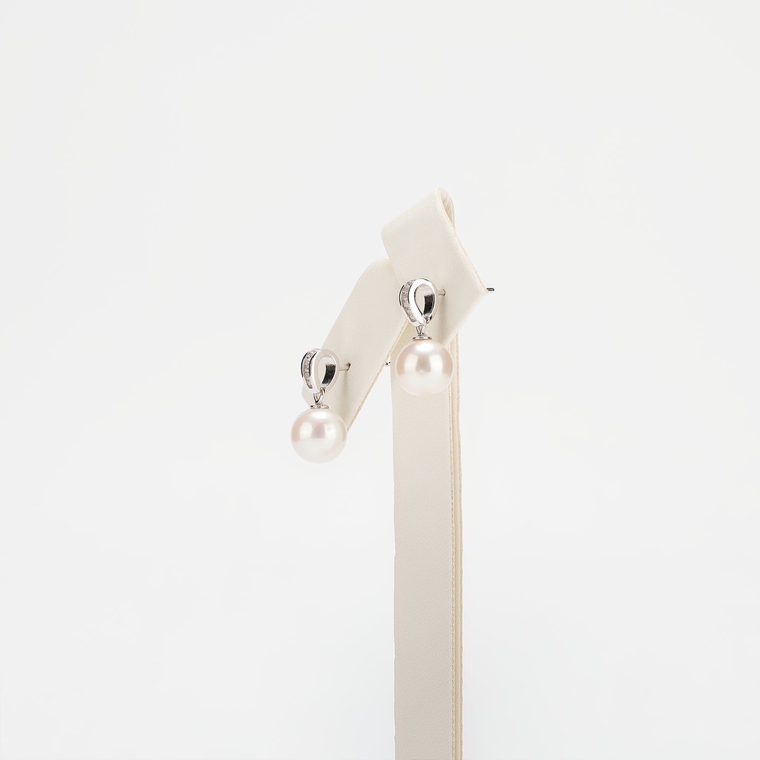 Pearl earrings on a white background