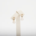 Pearl earrings on a white background