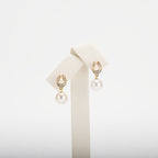 Pearl earrings on a white background