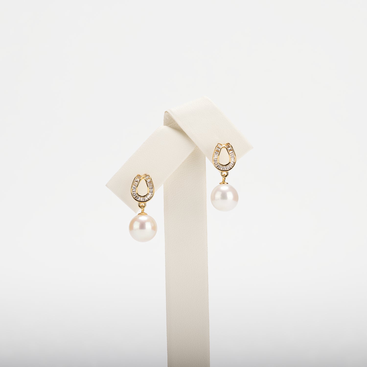 Pearl earrings on a white background