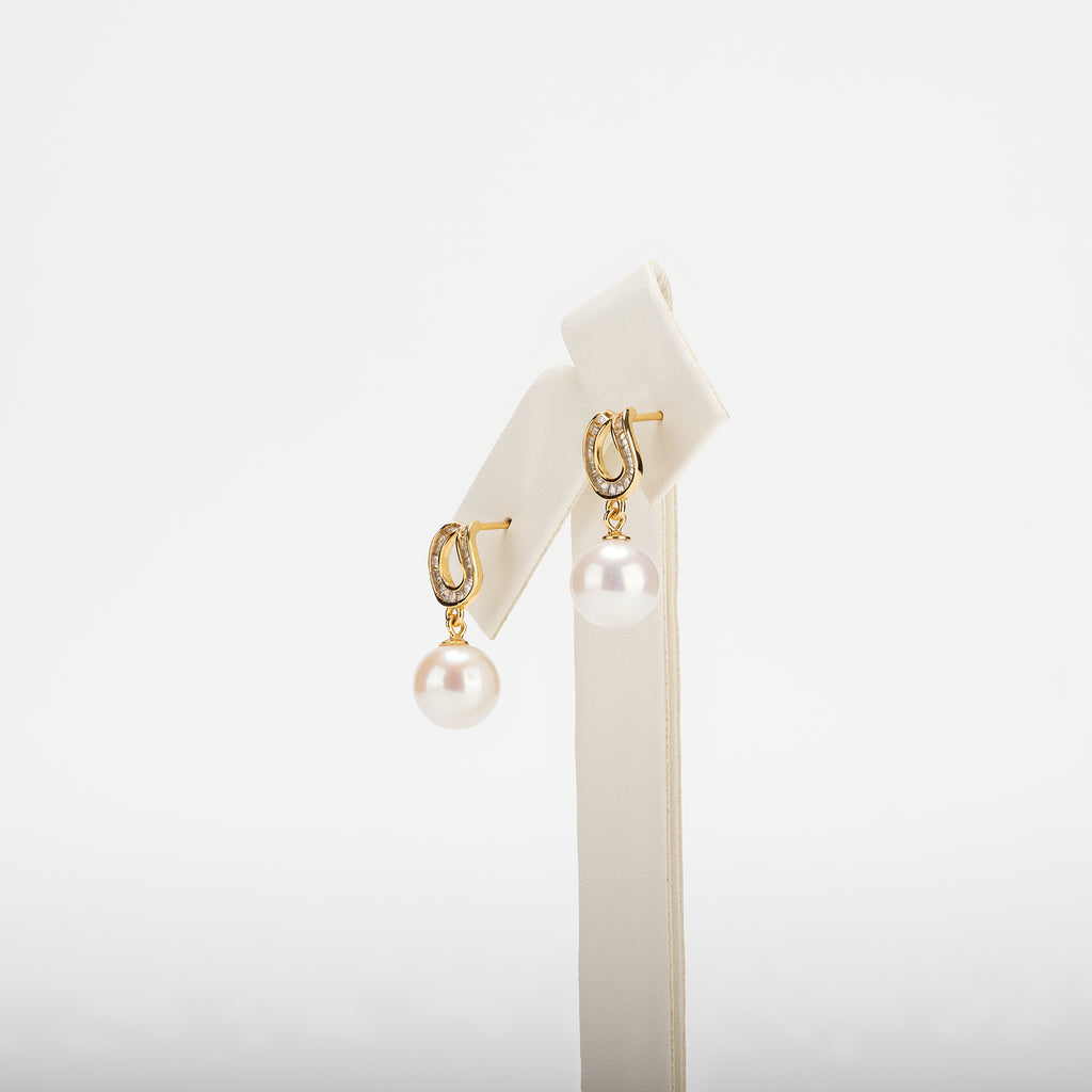 Pearl earrings on a white background