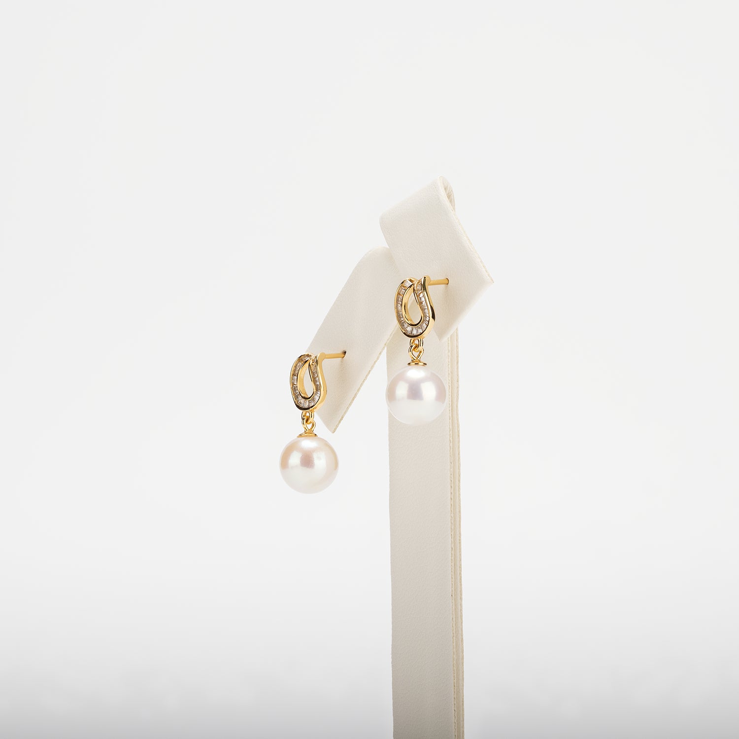 Pearl earrings on a white background