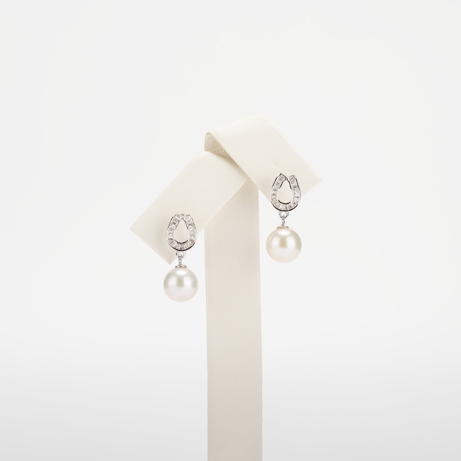Pearl earrings on a white background